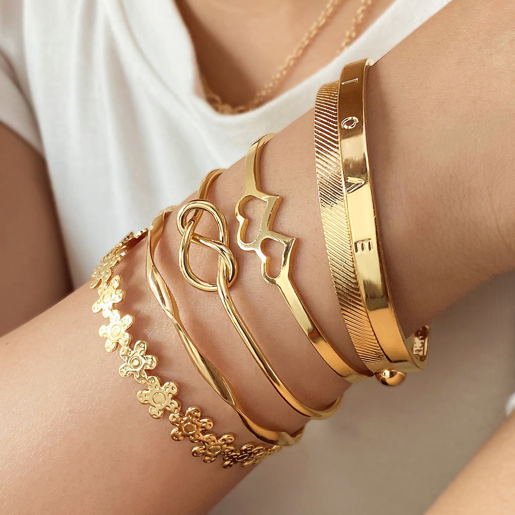 4-Piece Creative Heart Crossed Alloy Bangle Bracelet Set
