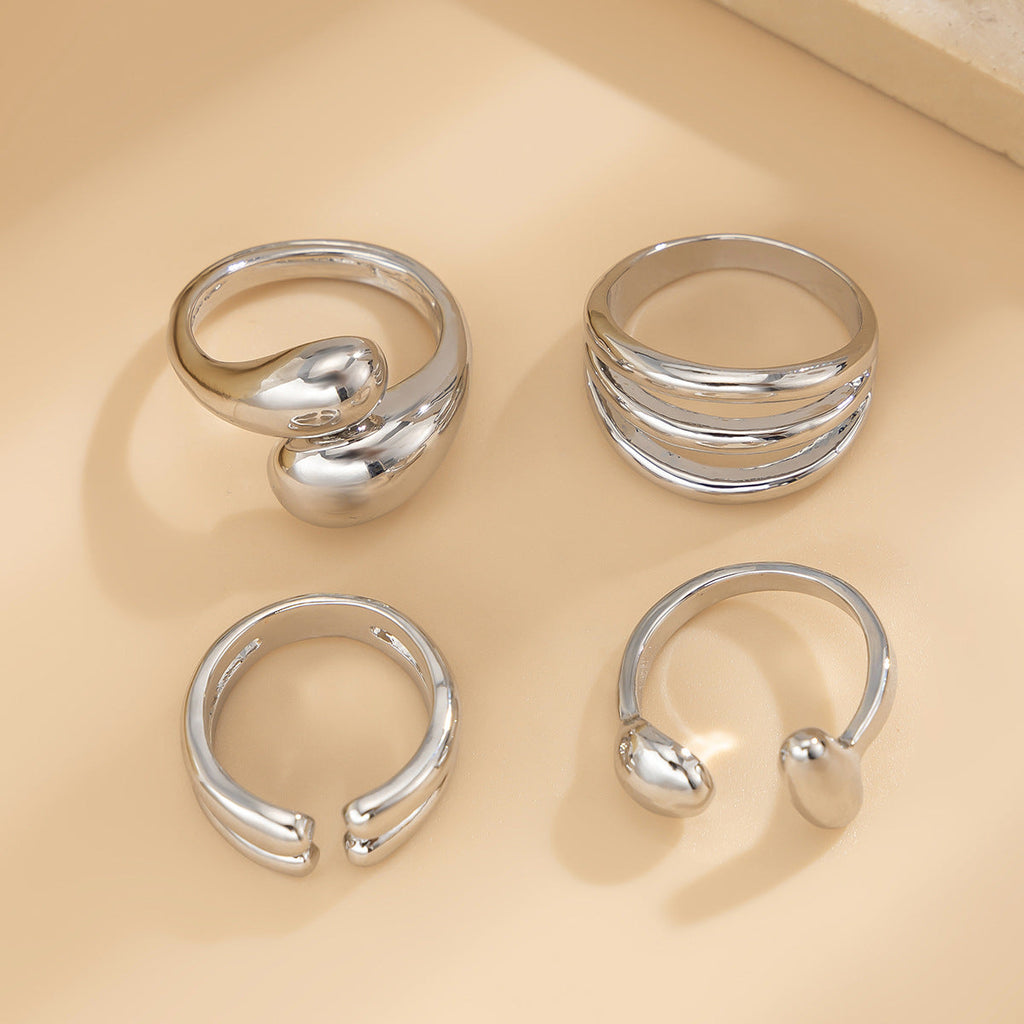 4-Piece Polished Liquid Metal Textured Ring Set