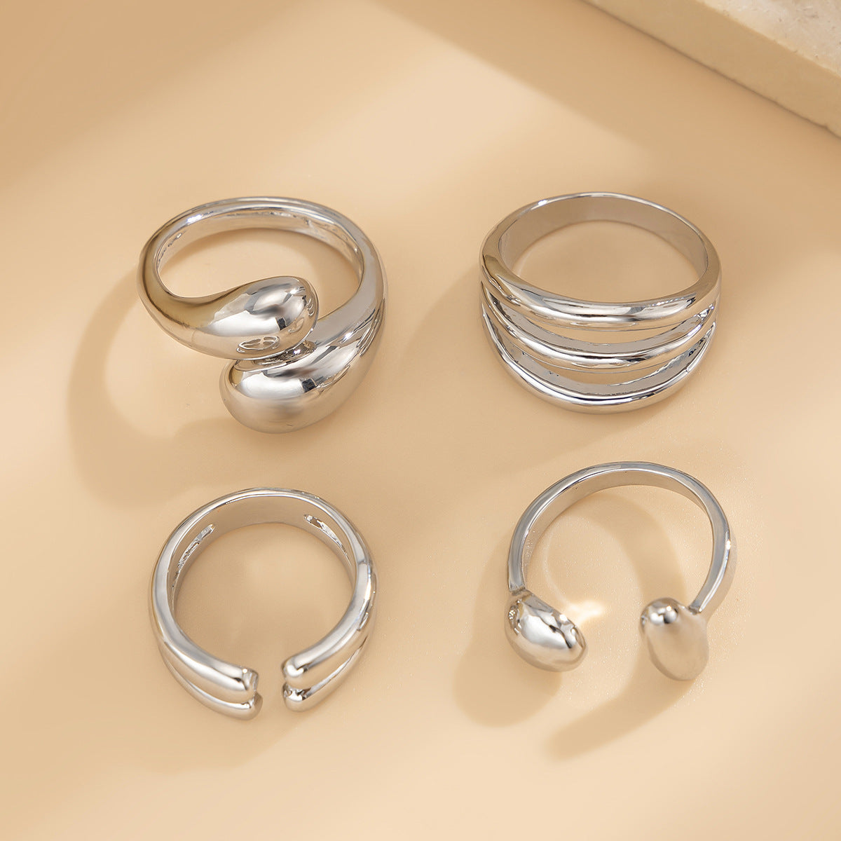 4-Piece Polished Liquid Metal Textured Ring Set
