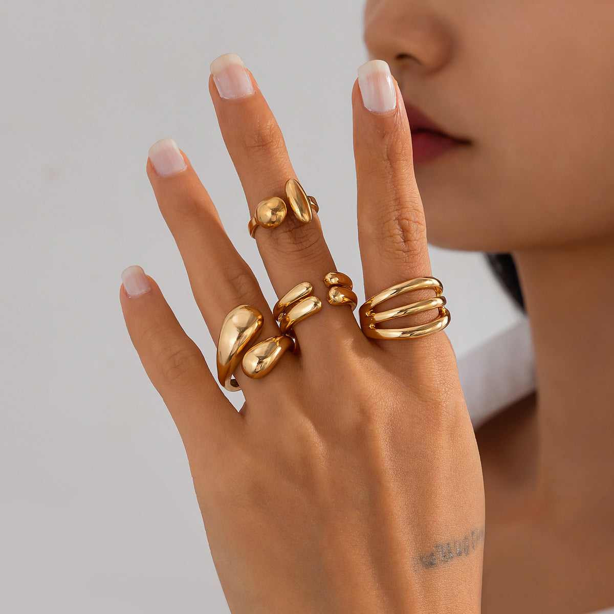 4-Piece Polished Liquid Metal Textured Ring Set